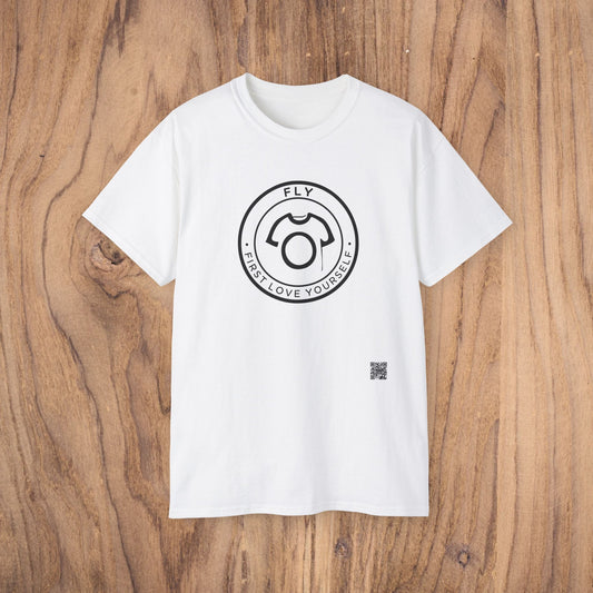 White t-shirt with a black circular logo on a wooden surface