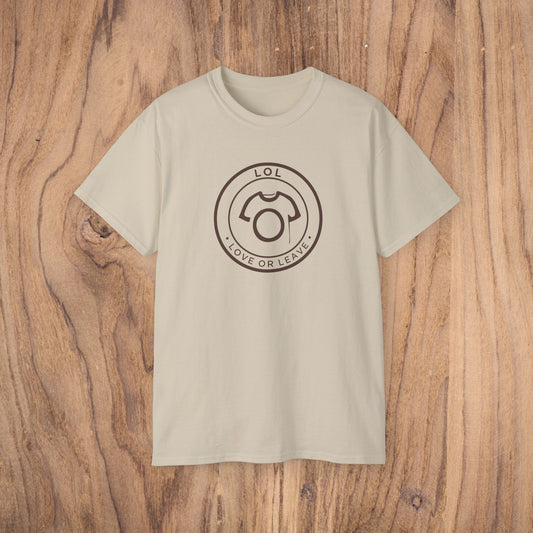 Beige t-shirt with a black logo on a wooden surface
